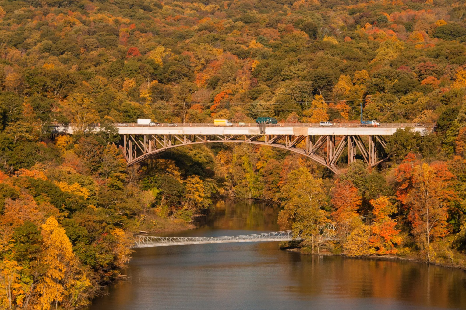 Route 9W bridge and the footbridge over Popolopen Creek in fall color, between Fort Clinton and Fort Montgomery